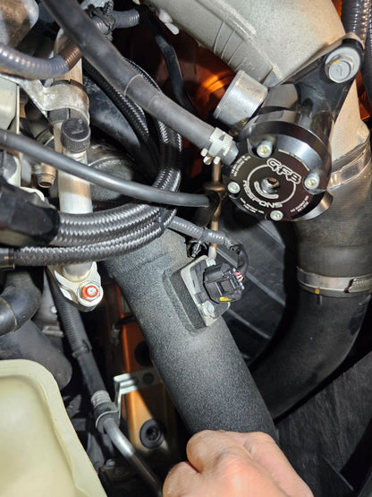 Aftermarket GFB blow off valve installed on a Nissan GTR R35 to enhance boost control and create adjustable turbo sound.