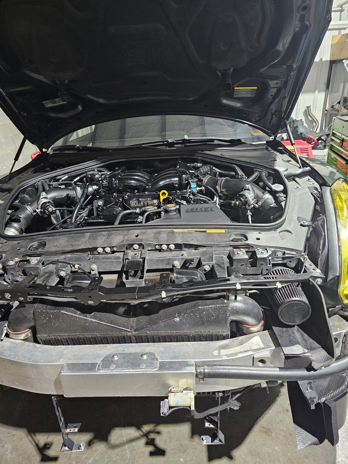 Nissan GTR R35 engine bay featuring the Go Fast Bits T9502 Deceptor Pro II blow off valve installed for improved turbo response.