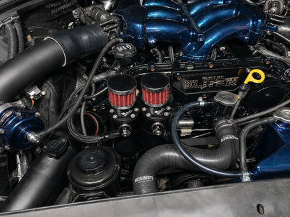 Radium catch can installed on a Nissan R35 GT-R engine bay
